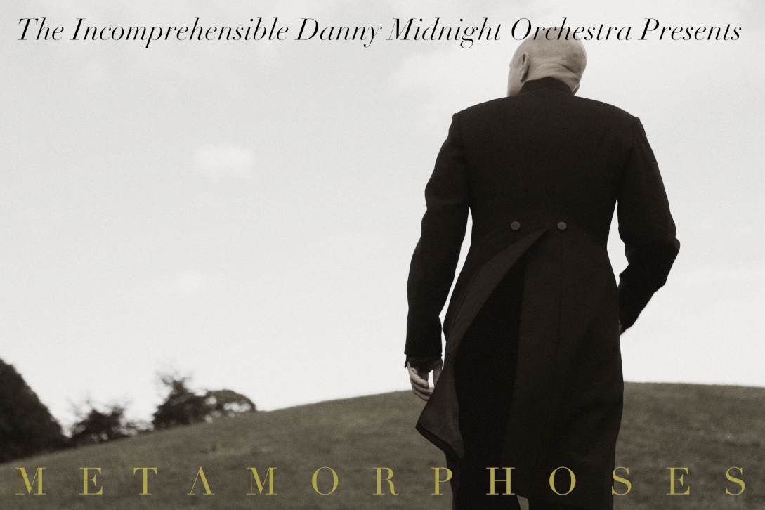The Incomprehensible Danny Midnight Orchestra is a band of three well-clad men and a steel gray machine.